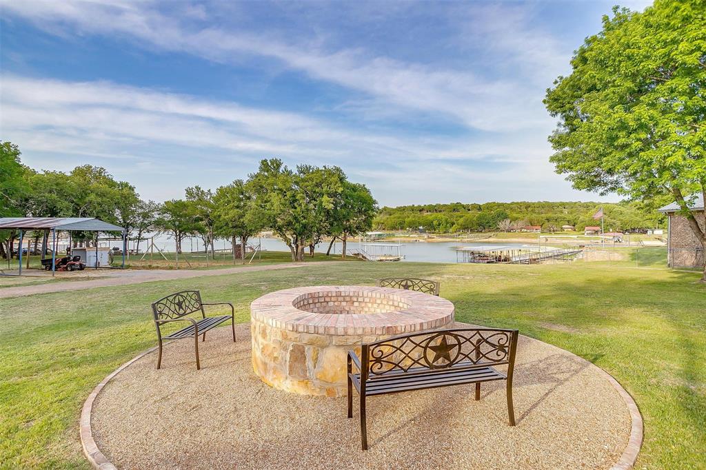 520 Deer Trail Gordon, TX 76453 - Photo 34 of 40 a swimming pool with outdoor seating and yard