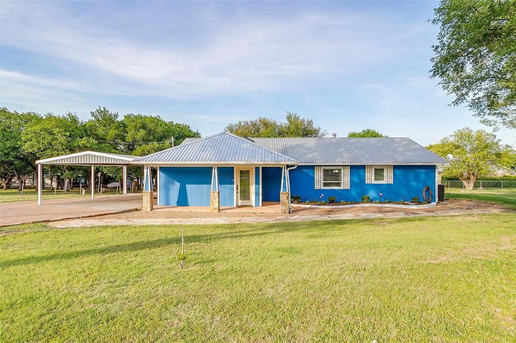 520 Deer Trail Gordon, TX 76453 - Photo 4 of 40 a front view of a house with a garden