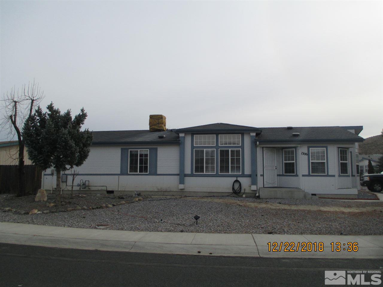 1306 Lynx Street Reno, NV 89506 - Photo 1 of 22 a front view of a house with a yard
