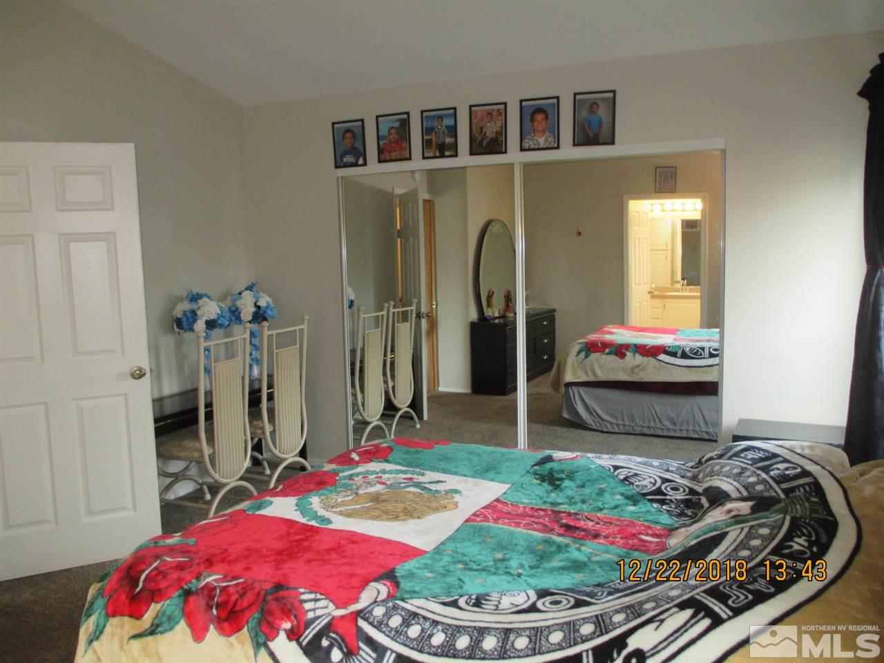 1306 Lynx Street Reno, NV 89506 - Photo 13 of 22 a bedroom with bed and a closet