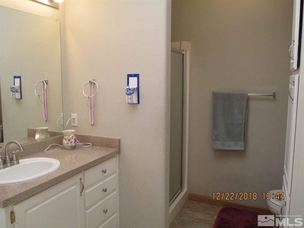 1306 Lynx Street Reno, NV 89506 - Photo 16 of 22 a bathroom with a sink and a mirror