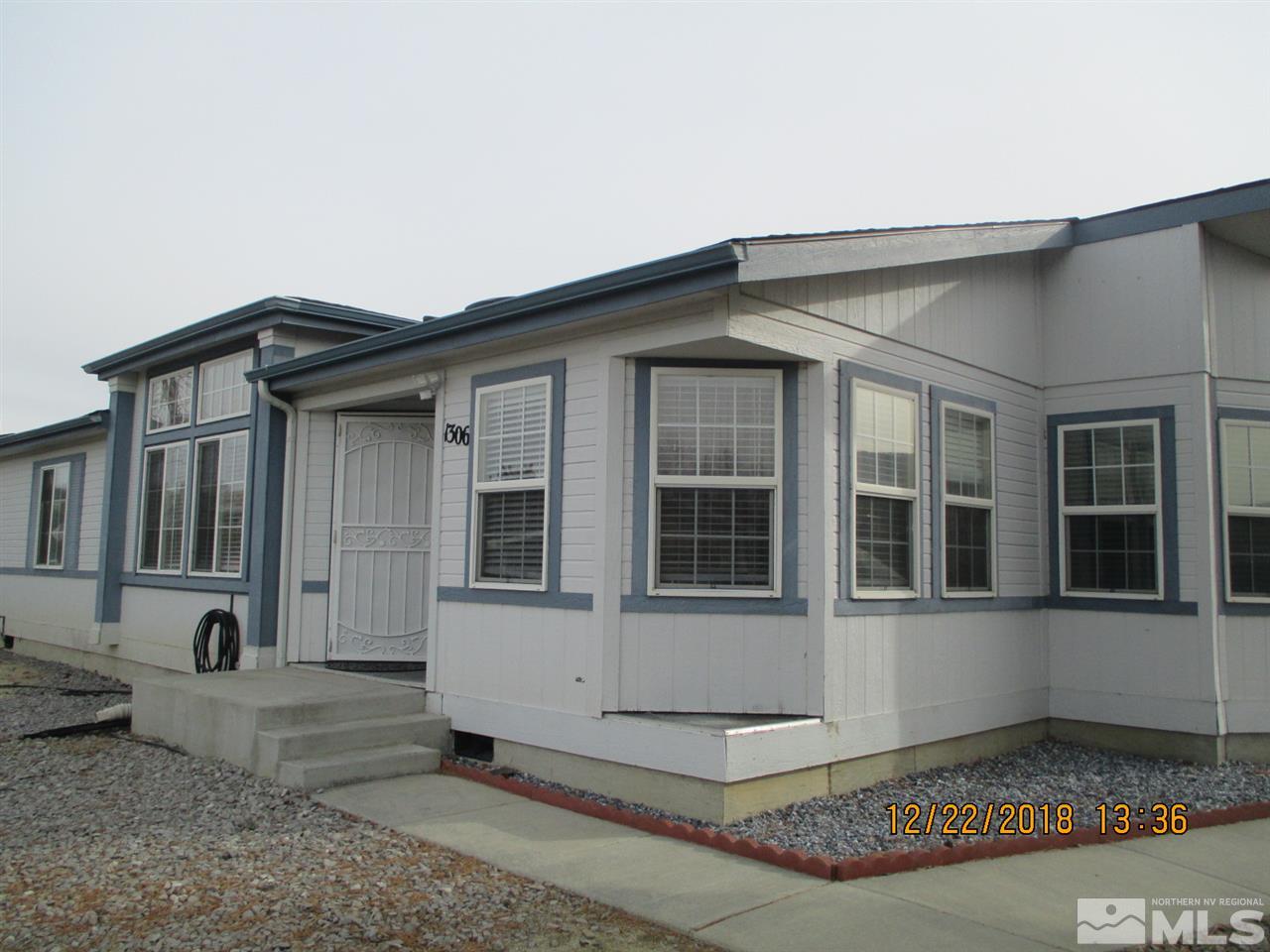 1306 Lynx Street Reno, NV 89506 - Photo 3 of 22 a front view of a house with a yard