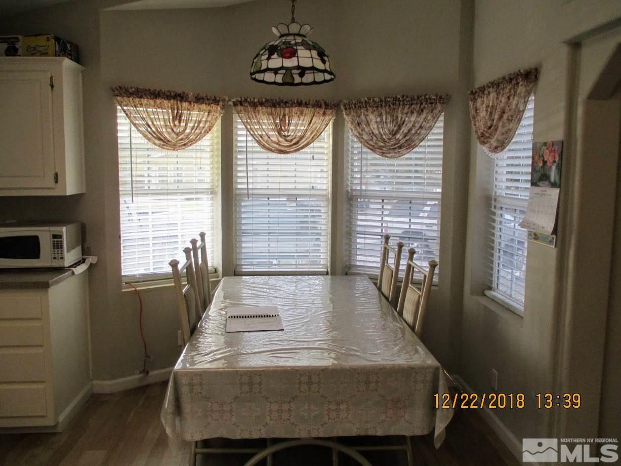 1306 Lynx Street Reno, NV 89506 - Photo 5 of 22 a dining room with wooden floor