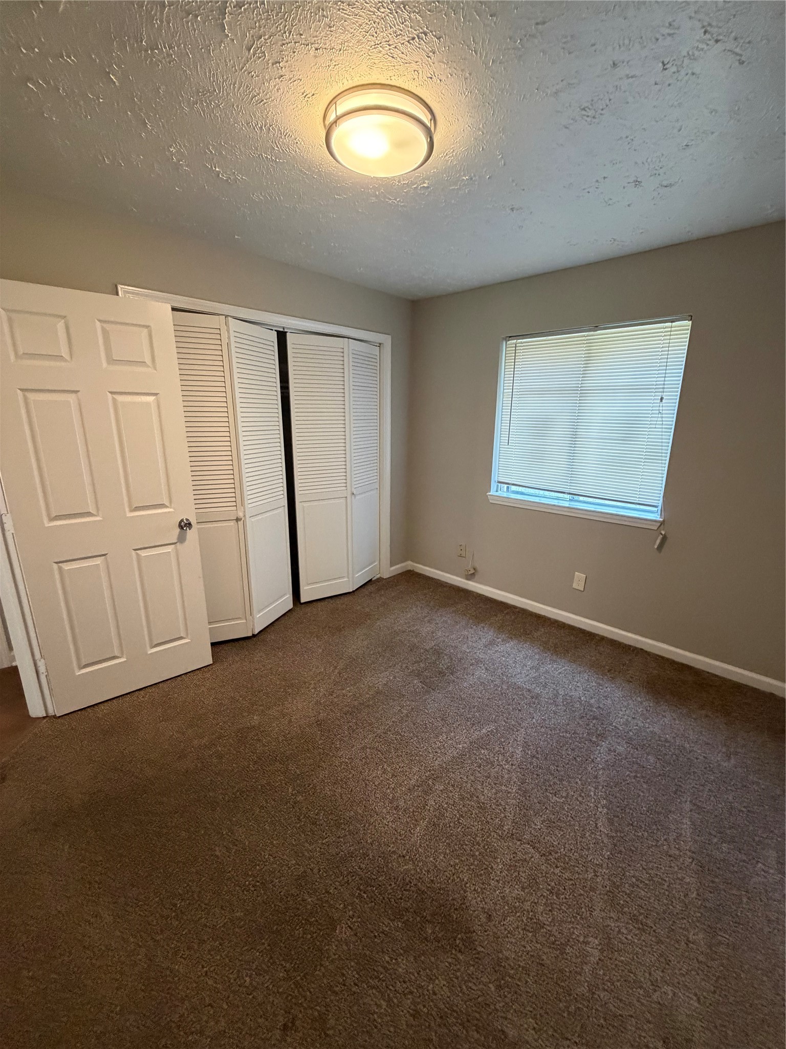 8662 Pearl Point Street Houston, TX 77044 - Photo 17 of 28 an empty room with a window