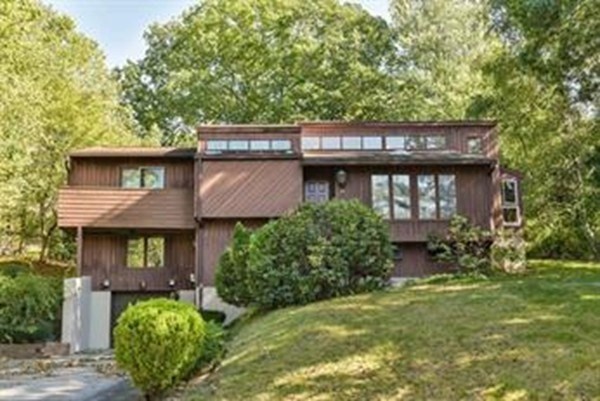 54 Drumlin Road Newton, MA 02459 - Photo 1 of 1 a view of a house with a yard and plants