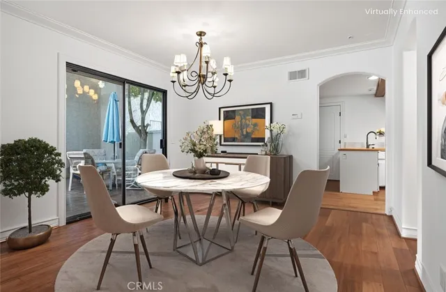 a kitchen with a sink appliances and cabinets