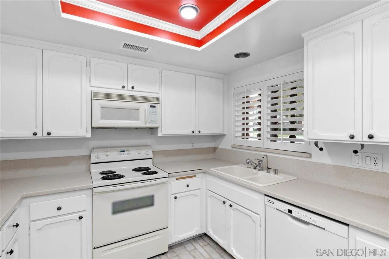 12491 Rios Road Rancho Bernardo, CA 92128 - Photo 12 of 21 a kitchen with appliances cabinets and a sink