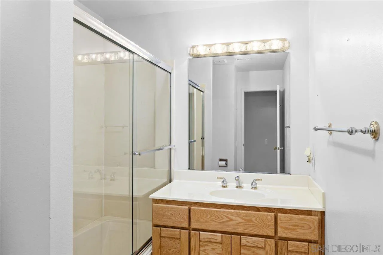 12491 Rios Road Rancho Bernardo, CA 92128 - Photo 20 of 21 a bathroom with a sink and mirror