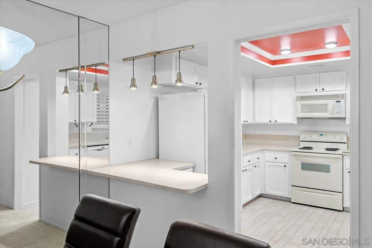 12491 Rios Road Rancho Bernardo, CA 92128 - Photo 10 of 21 a kitchen with cabinets and white appliances