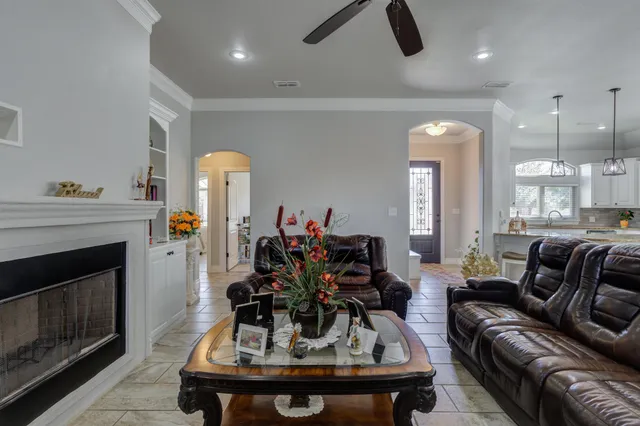 a living room with furniture and a fireplace