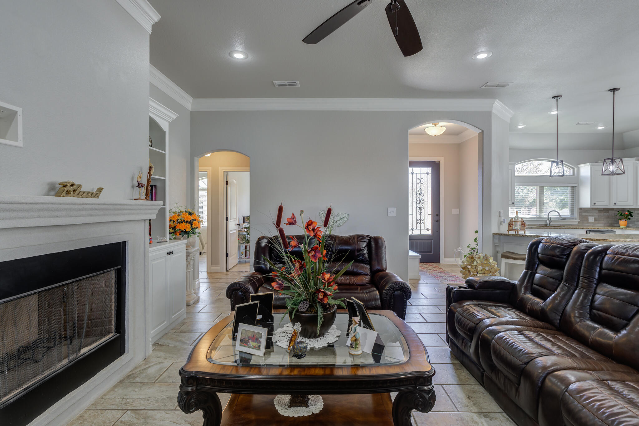 6306 87th Street Lubbock, TX 79424 - Photo 11 of 47 a living room with furniture and a fireplace