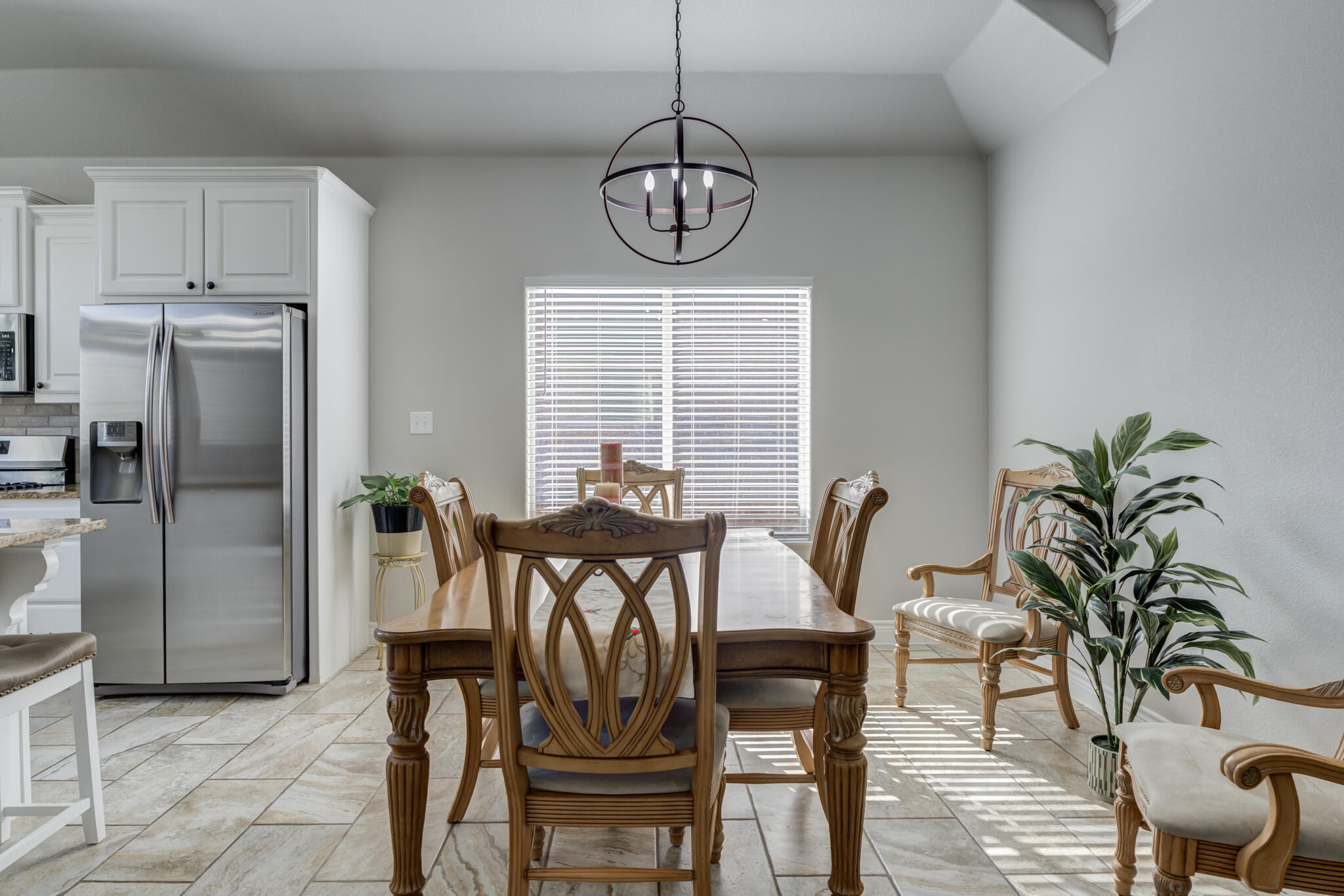 6306 87th Street Lubbock, TX 79424 - Photo 15 of 47 a view of a dining room with furniture window and wooden floor