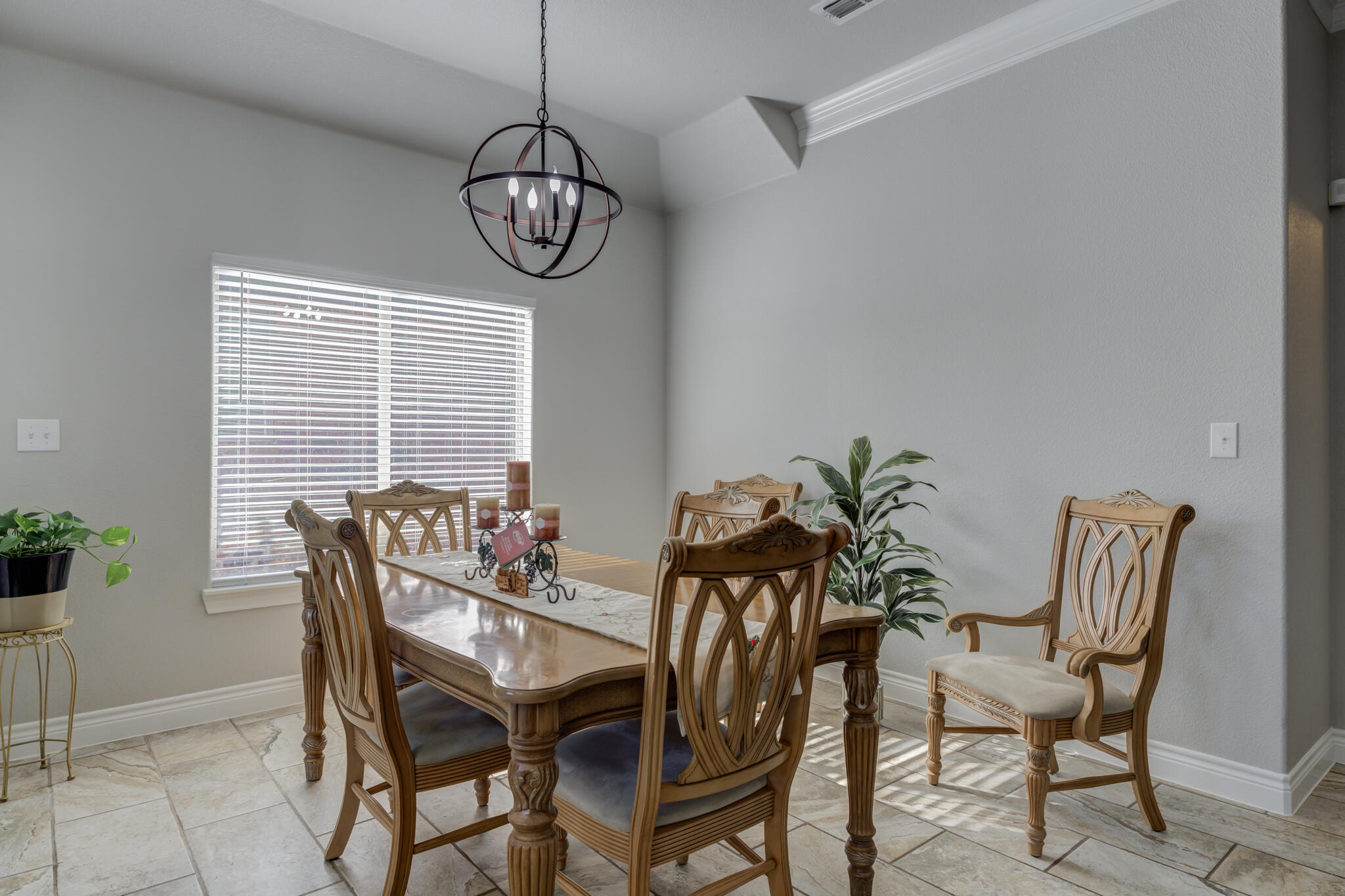 6306 87th Street Lubbock, TX 79424 - Photo 17 of 47 a dining room with furniture window and wooden floor
