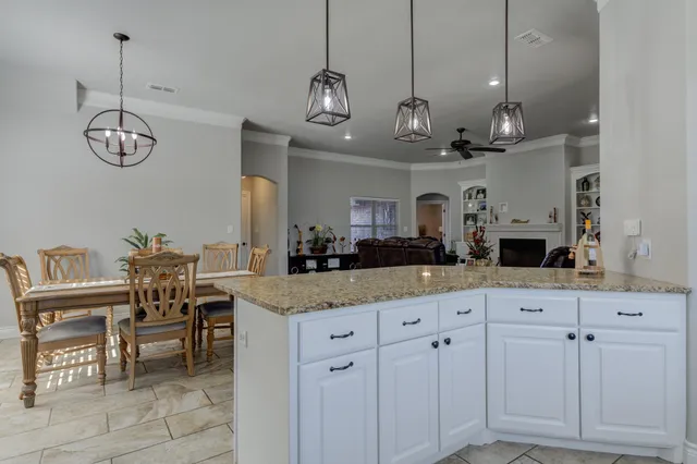 a kitchen with a counter space cabinets and appliances