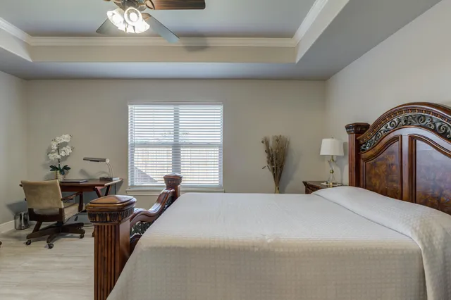 a bedroom with bed and window