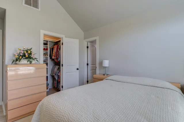 a bedroom with a bed and a closet