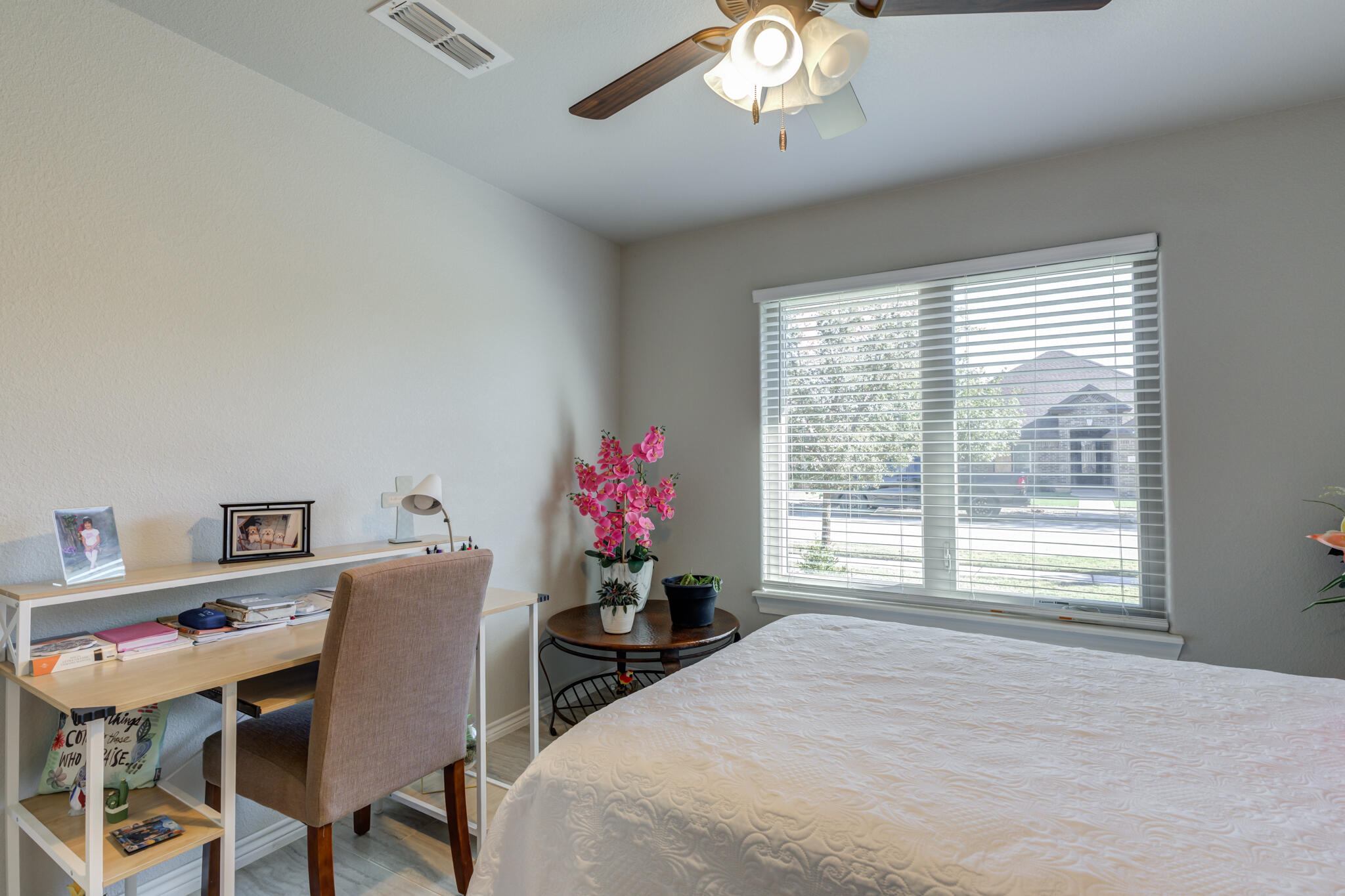 6306 87th Street Lubbock, TX 79424 - Photo 42 of 47 a bed room with a bed window and a chair