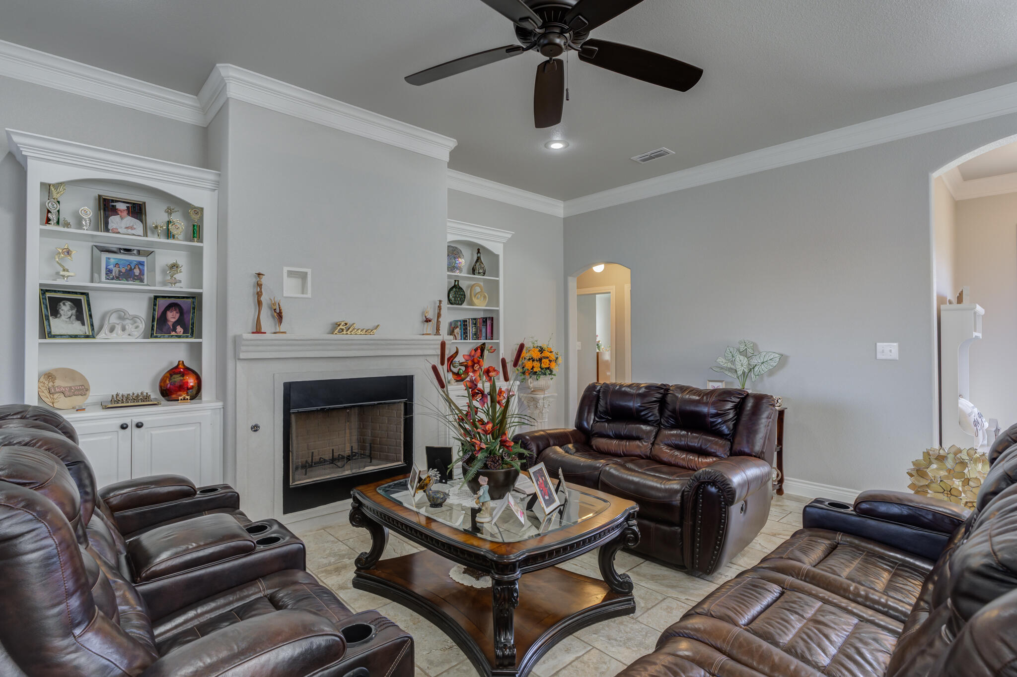 6306 87th Street Lubbock, TX 79424 - Photo 10 of 47 a living room with furniture a fireplace and a window