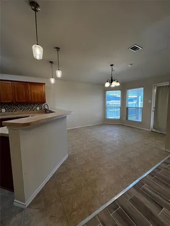 a view of a kitchen with a sink and dishwasher kitchen view