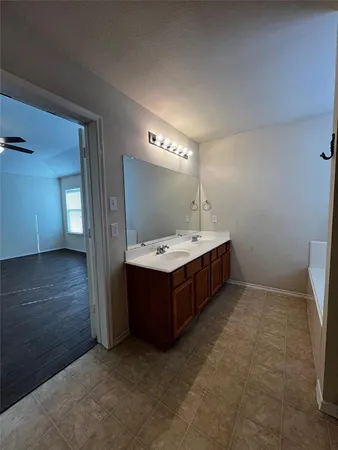 a bathroom with a sink double vanity and a mirror