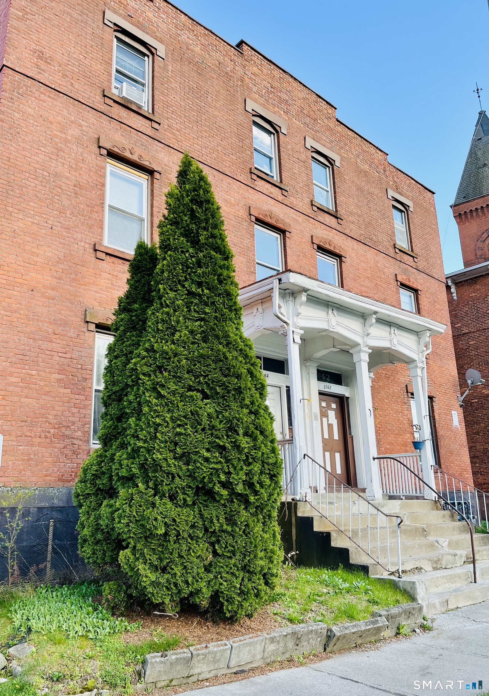 2062 Main Street, Unit B2 Hartford, CT 06120 - Photo 1 of 1 a front view of a multi story residential apartment building