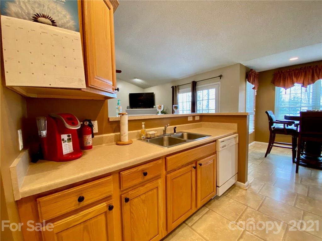 1168 Balfour Quarry Road Salisbury, NC 28146 - Photo 11 of 47 a kitchen with stainless steel appliances granite countertop a sink and a stove