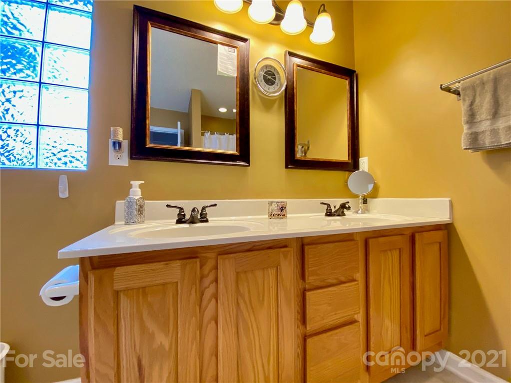 1168 Balfour Quarry Road Salisbury, NC 28146 - Photo 30 of 47 a bathroom with a sink vanity and a mirror
