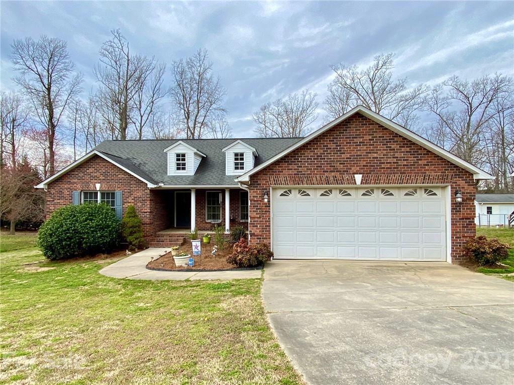 1168 Balfour Quarry Road Salisbury, NC 28146 - Photo 4 of 47 a front view of a house with yard garage and seating area