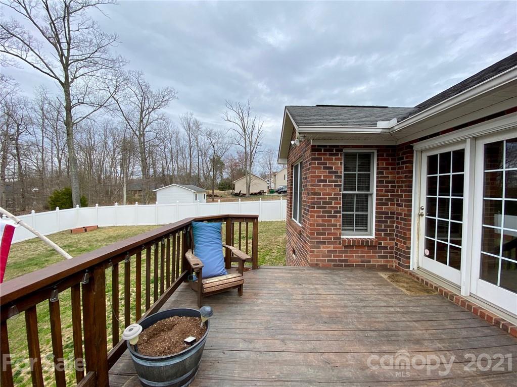 1168 Balfour Quarry Road Salisbury, NC 28146 - Photo 47 of 47 a view of a balcony with chairs and wooden fence