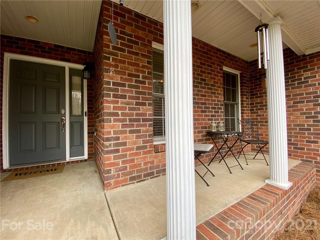 1168 Balfour Quarry Road Salisbury, NC 28146 - Photo 8 of 47 a view of porch with a table and chair
