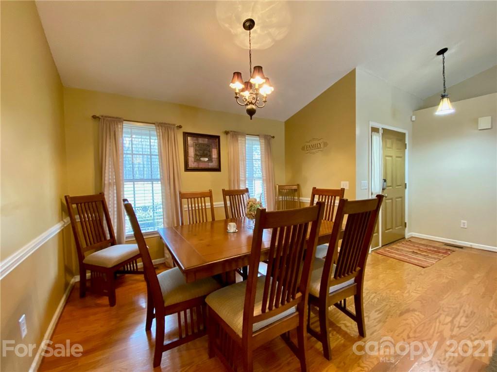 1168 Balfour Quarry Road Salisbury, NC 28146 - Photo 9 of 47 a view of a dining room with furniture and chandelier