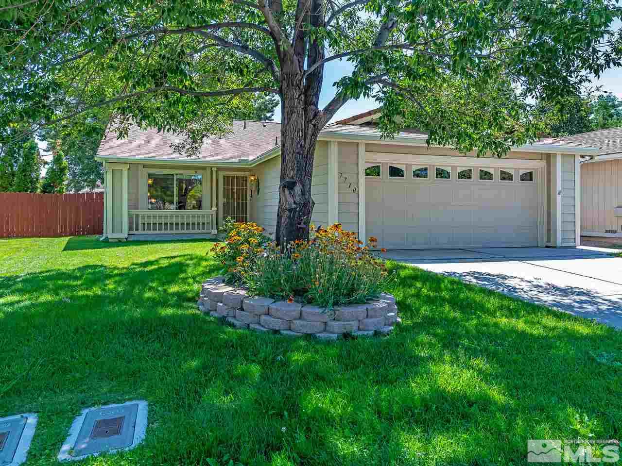 7710 Pickering Circle Reno, NV 89511 - Photo 1 of 16 a front view of house with a garden