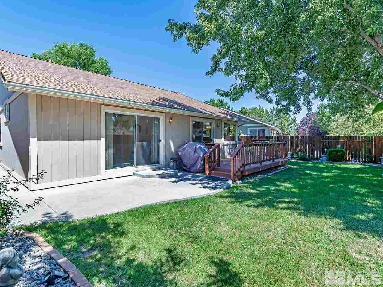 7710 Pickering Circle Reno, NV 89511 - Photo 14 of 16 a view of a house with a backyard