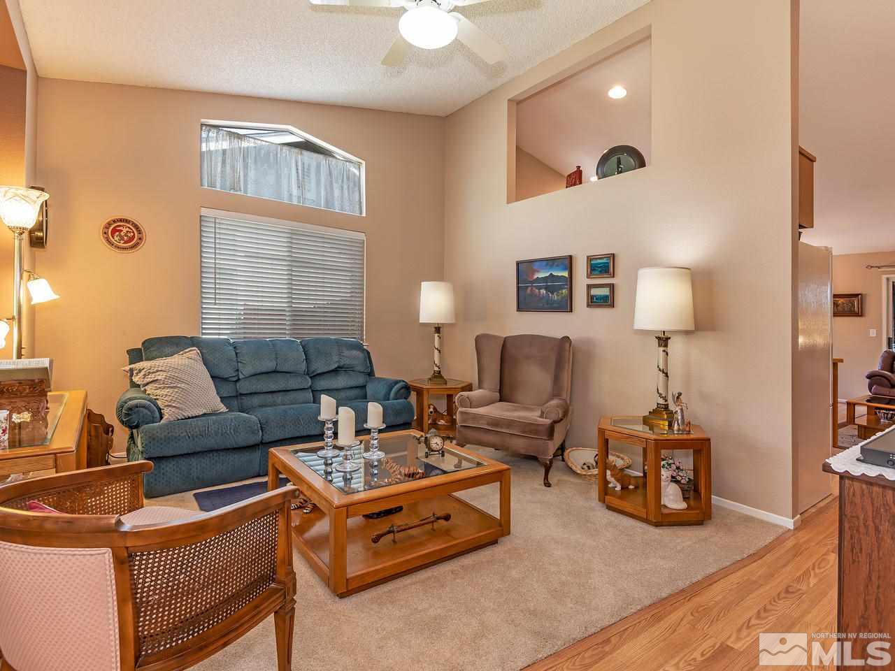 7710 Pickering Circle Reno, NV 89511 - Photo 6 of 16 a living room with furniture and a lamp