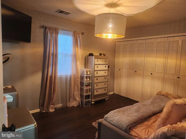 a bed room with a bed and a couch