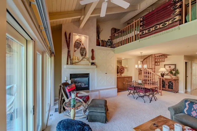 a view of a livingroom with furniture and a fireplace