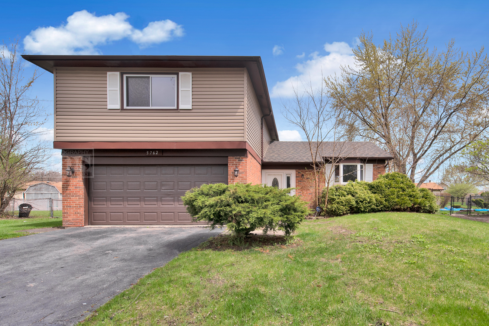 5762 Timberlane Road Matteson, IL 60443 - Photo 1 of 23 a front view of a house with garden