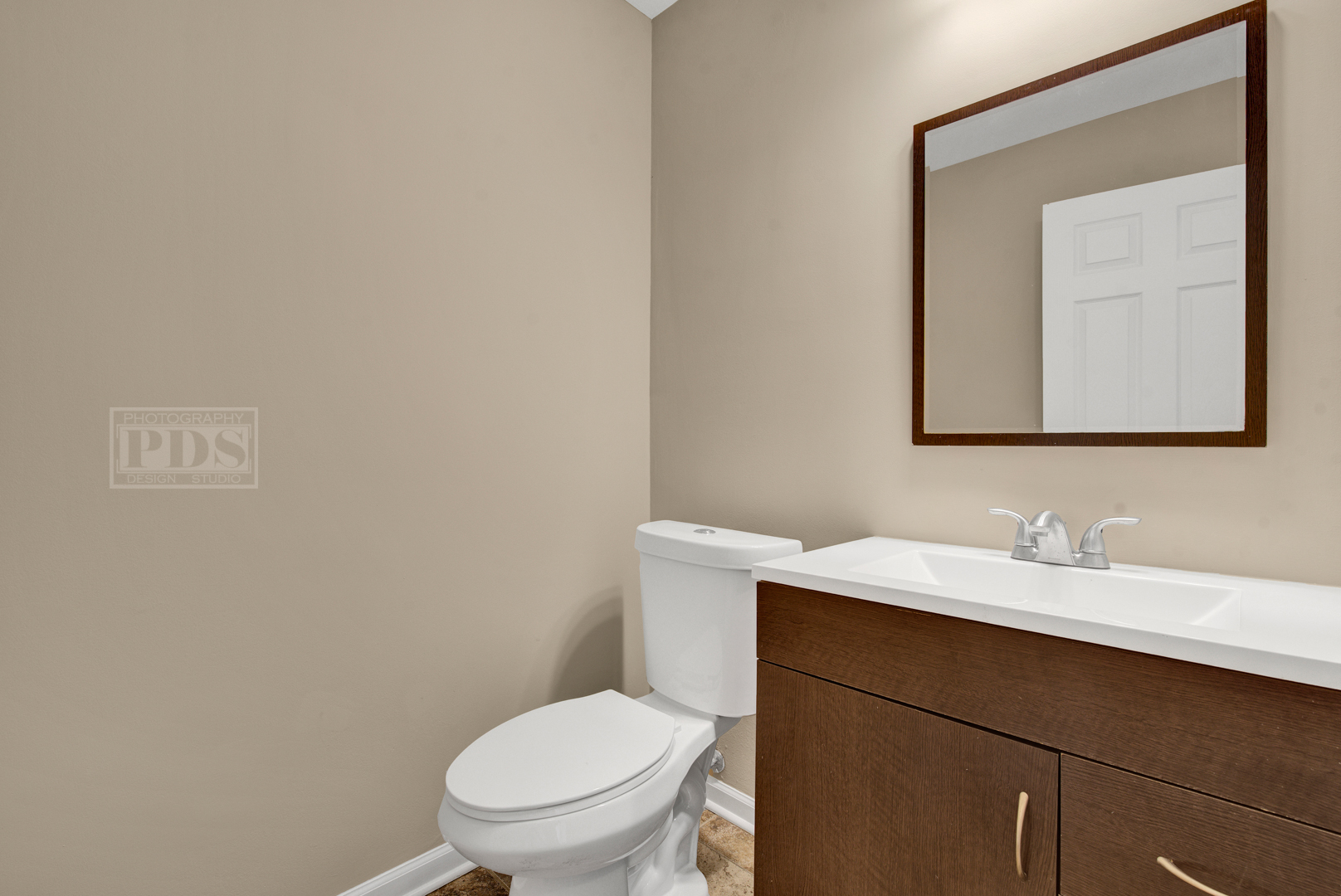 5762 Timberlane Road Matteson, IL 60443 - Photo 11 of 23 a bathroom with a toilet sink and mirror