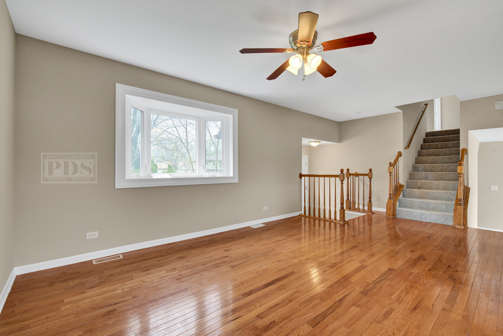 5762 Timberlane Road Matteson, IL 60443 - Photo 3 of 23 a view of an empty room with wooden floor and a window