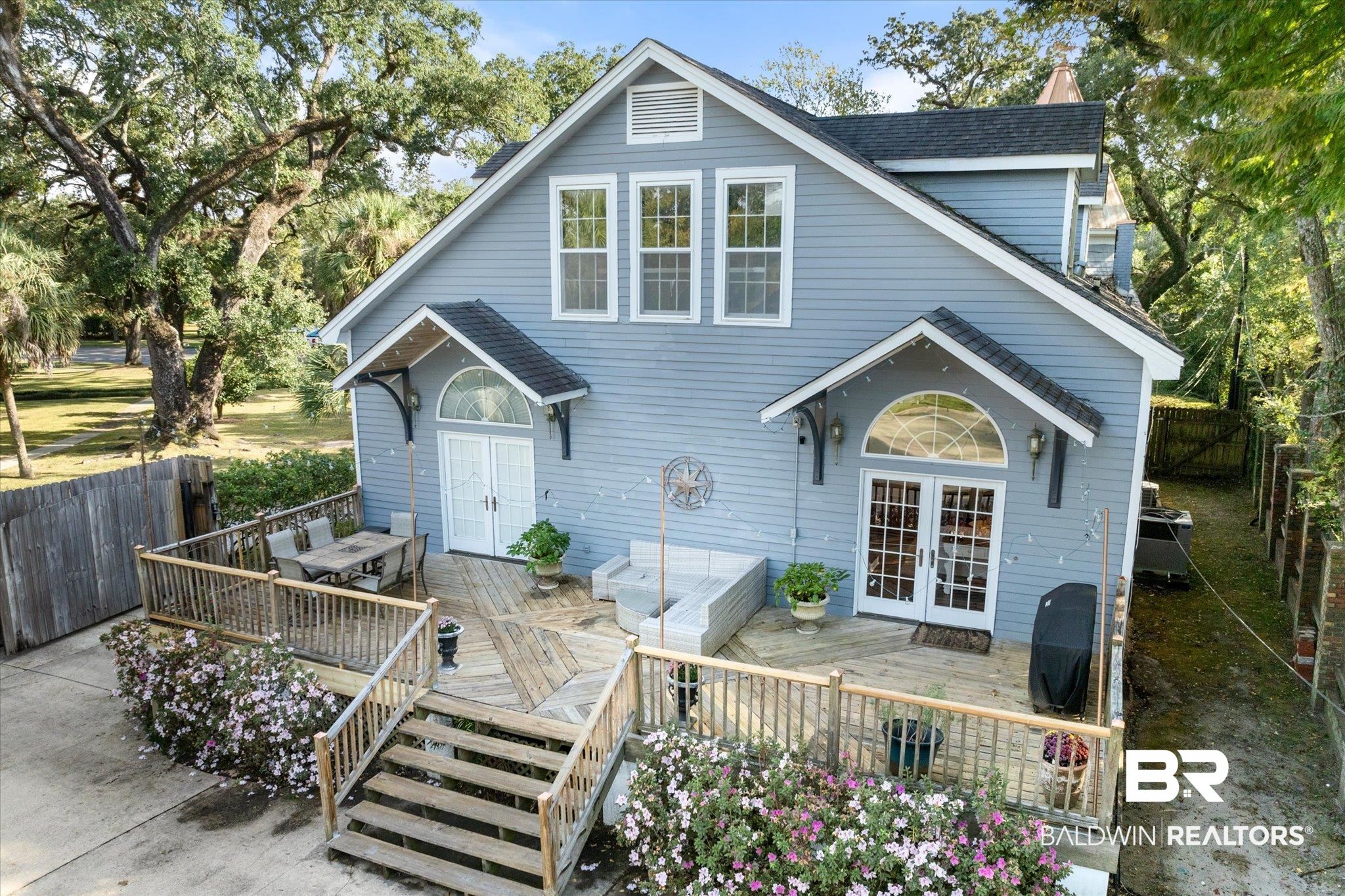 1210 Government Street Mobile, AL 36604 - Photo 27 of 37 Back of property with a wooden deck, an outdoor living space, and french doors