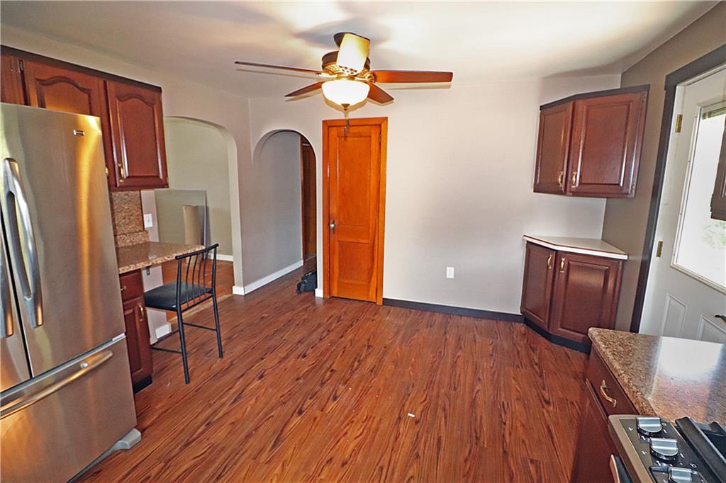 107 Penn Street Greensburg, PA 15601 - Photo 3 of 11 a view of a livingroom with furniture wooden floor and a window