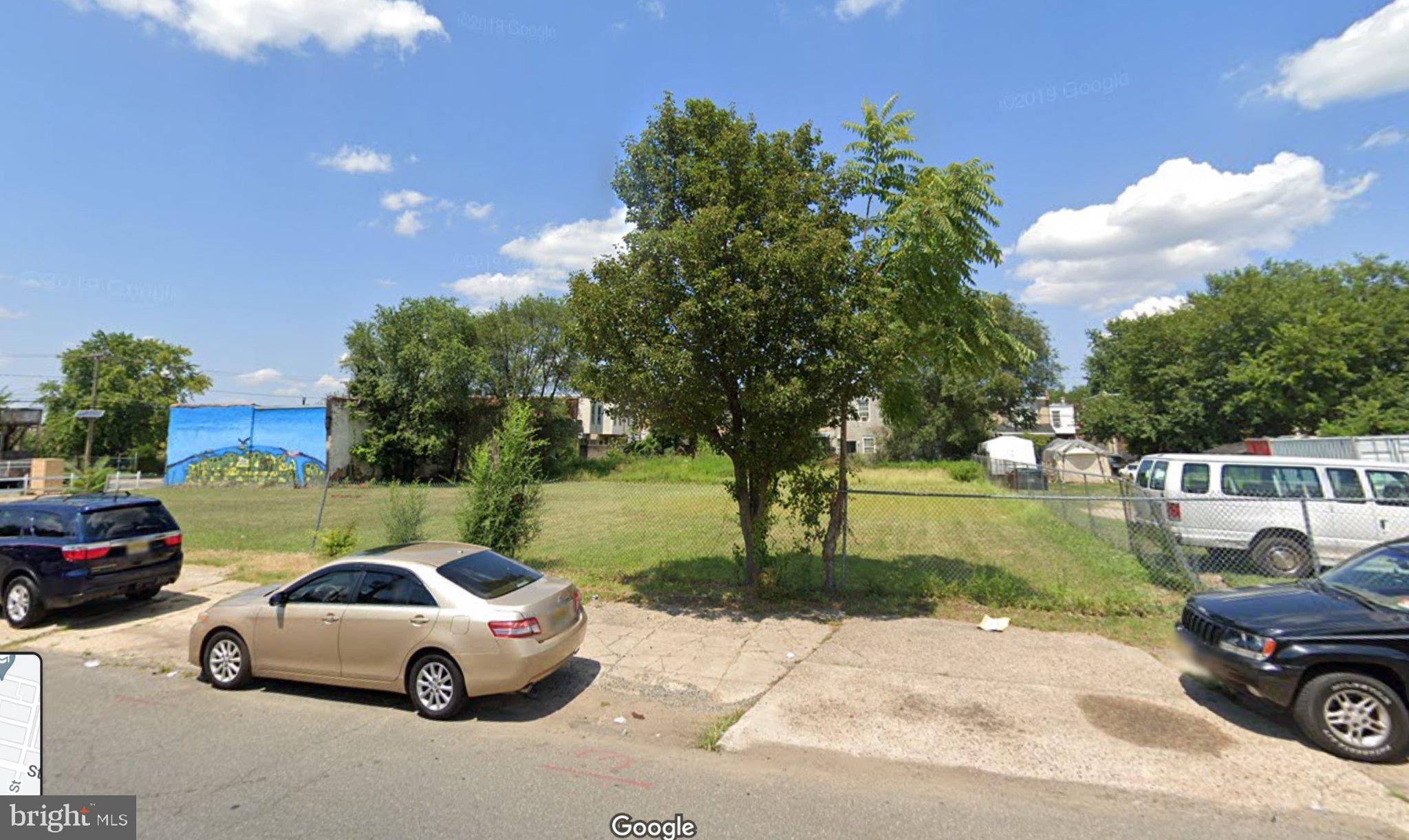 723 State Street Camden, NJ 08102 - Photo 2 of 3 a front view of a house with a garden