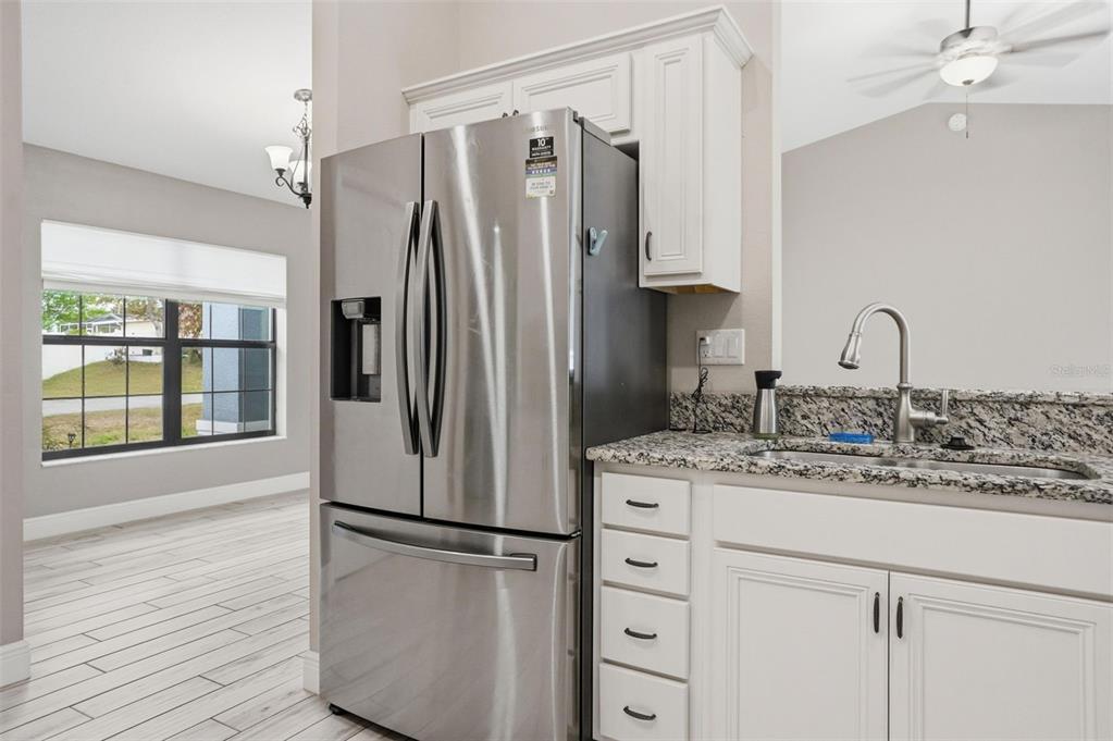 4128 Everett Avenue Spring Hill, FL 34609 - Photo 13 of 57 a kitchen with appliances a sink and a window