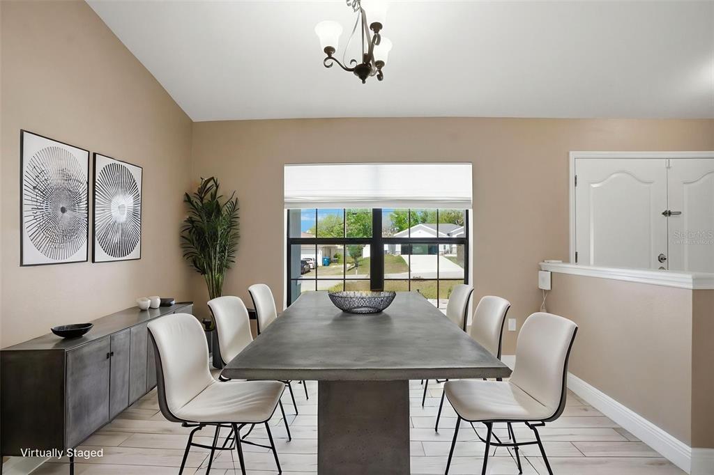 4128 Everett Avenue Spring Hill, FL 34609 - Photo 18 of 57 a view of a dining room with furniture window and outside view