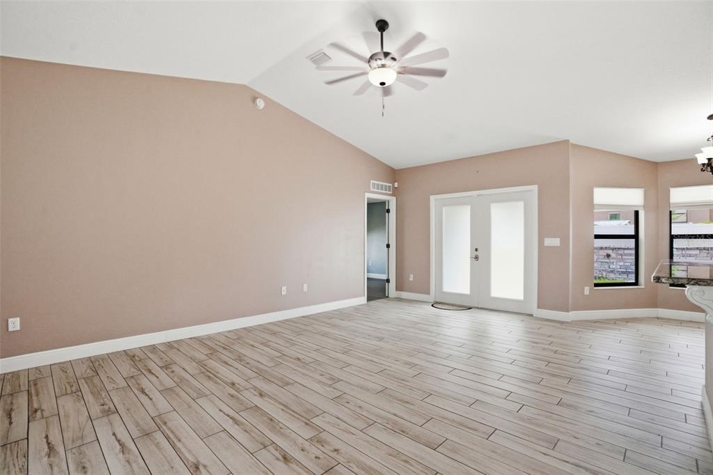4128 Everett Avenue Spring Hill, FL 34609 - Photo 20 of 57 a view of an empty room with window and wooden floor