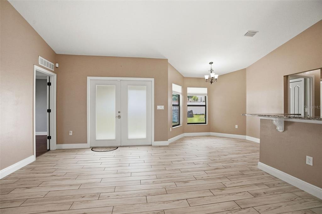 4128 Everett Avenue Spring Hill, FL 34609 - Photo 23 of 57 a view of an empty room with window and wooden floor
