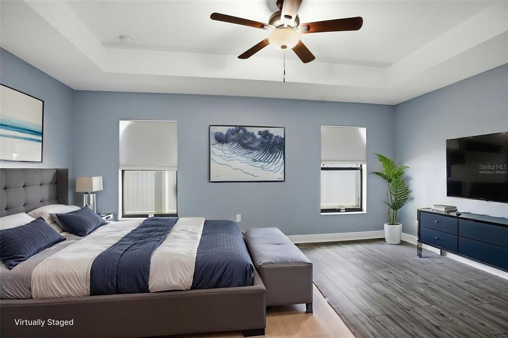 4128 Everett Avenue Spring Hill, FL 34609 - Photo 25 of 57 a bedroom with a bed and a flat screen tv
