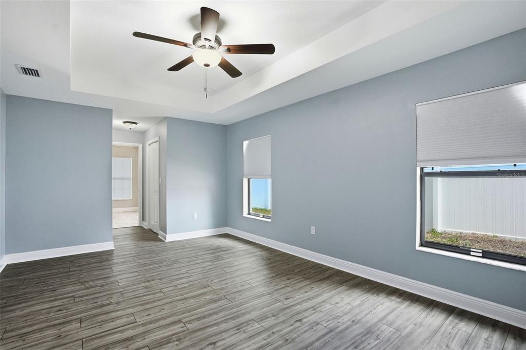 4128 Everett Avenue Spring Hill, FL 34609 - Photo 26 of 57 a view of an empty room with a window and wooden floor