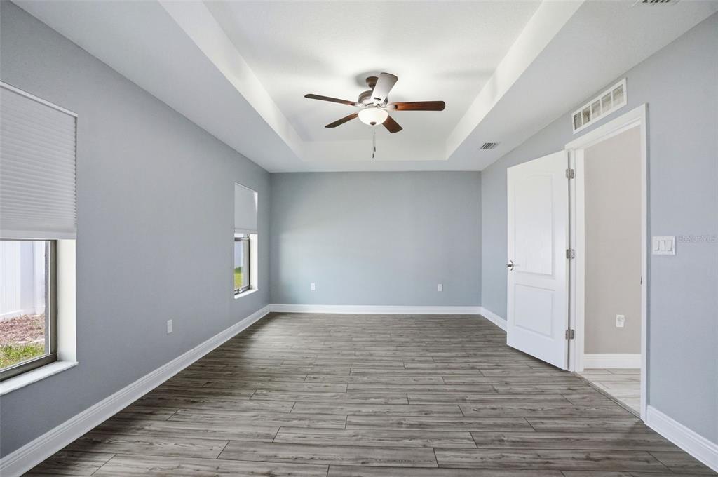 4128 Everett Avenue Spring Hill, FL 34609 - Photo 28 of 57 wooden floor in an empty room with a window