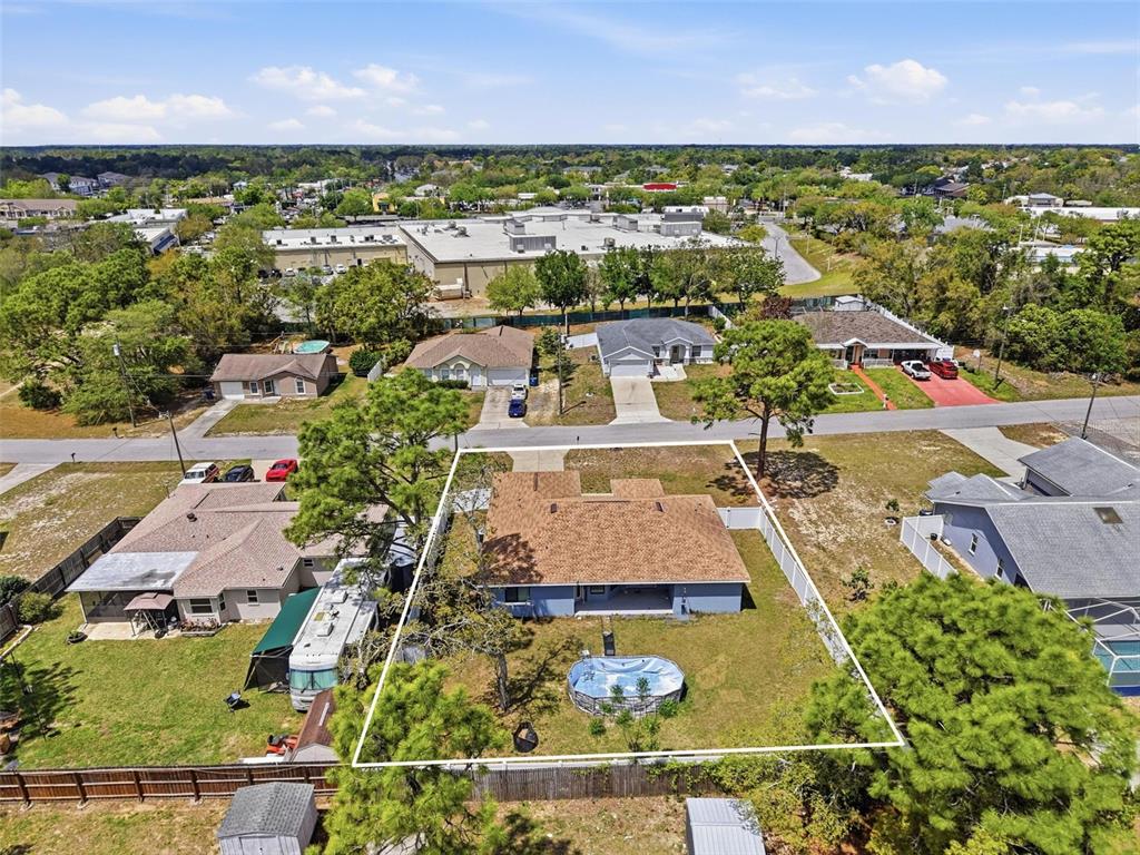 4128 Everett Avenue Spring Hill, FL 34609 - Photo 3 of 57 an aerial view of residential houses with outdoor space